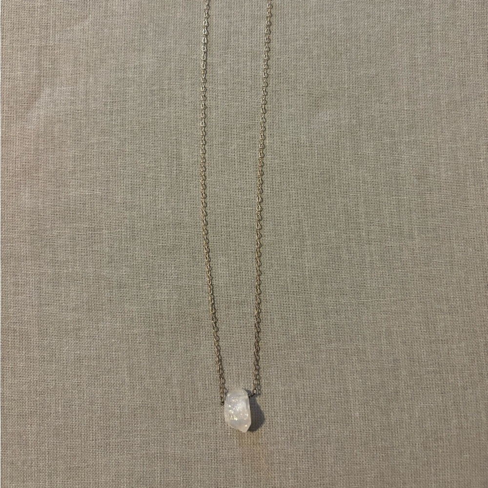 Sterling silver necklace with rough “floating stone”